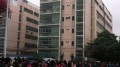 Workers stand at the top of a building threatening to jump, courtesy of  http://lc.cf8.com.cn