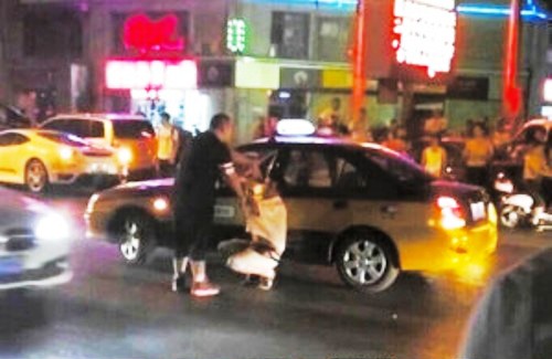 beijing ferrari owner beats taxi cabbie assault